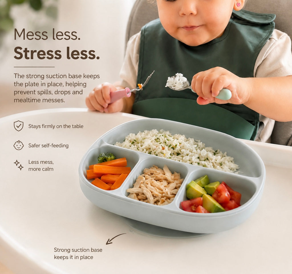 A baby wearing a dark green bib sits in a high chair using a light blue divided meal plate with rice and vegetables, with marketing text on the left side.