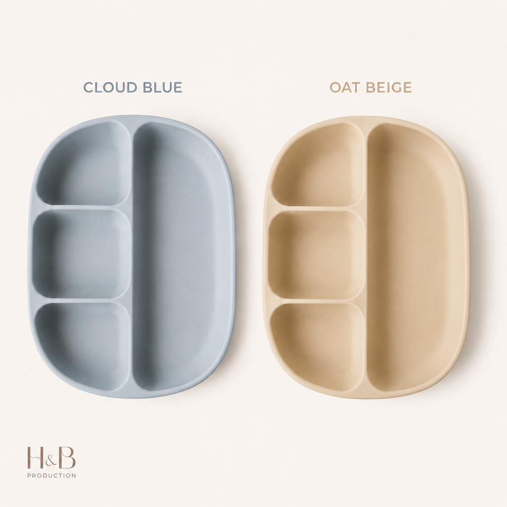 Two divided baby plates shown side by side on a light cream background. The left plate is labeled 'CLOUD BLUE' and is a muted light blue-gray.