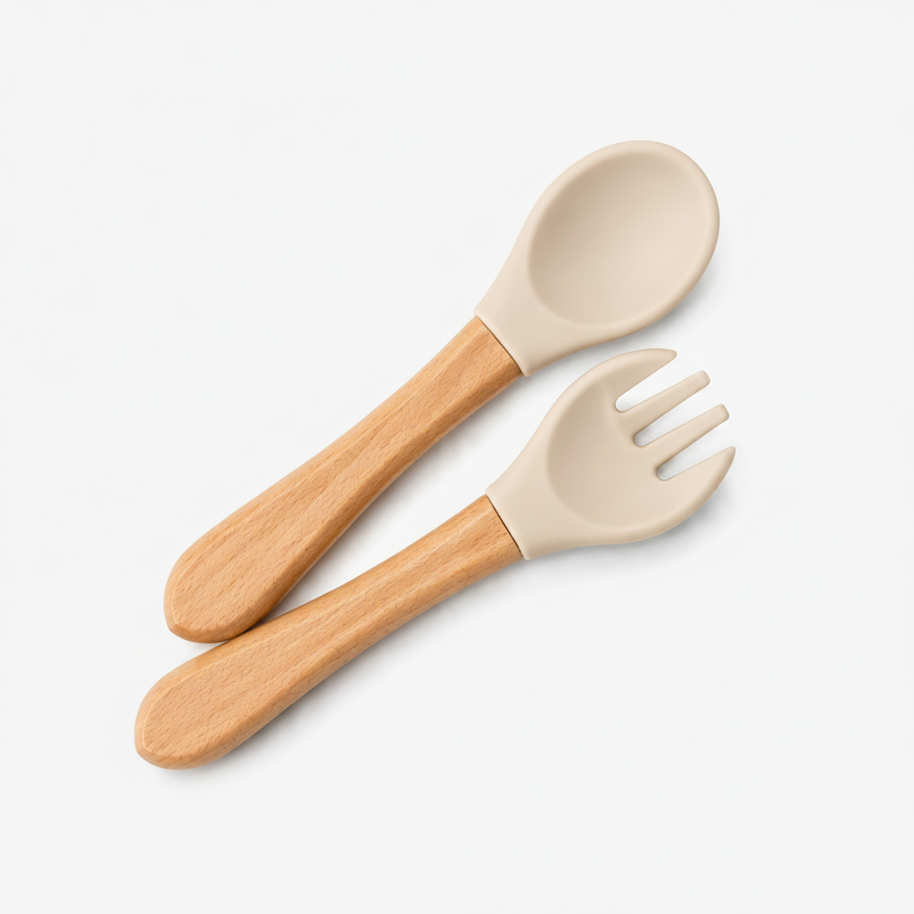 A baby feeding utensil set consisting of a wooden spoon and fork with beige silicone heads, shown on a plain white background.